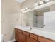 Bathroom with a wood cabinet vanity, white countertop, and a large mirror over the sink at 117 Ella Kinley Circle # 201, Myrtle Beach, SC 29588