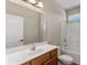 This bathroom features a white countertop, wood cabinets, a toilet, and a shower with tile surround at 117 Ella Kinley Circle # 201, Myrtle Beach, SC 29588