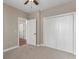 Bedroom with carpeting, a closet, and a door, making it cozy and practical at 117 Ella Kinley Circle # 201, Myrtle Beach, SC 29588