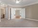 Spacious bedroom showcasing an open doorway and plush carpeting, creating a comfortable and inviting atmosphere at 117 Ella Kinley Circle # 201, Myrtle Beach, SC 29588