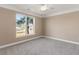 Bedroom with carpet flooring, ceiling fan and exterior view at 117 Ella Kinley Circle # 201, Myrtle Beach, SC 29588