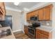 View of kitchen with stainless steel appliances and wood cabinetry at 117 Ella Kinley Circle # 201, Myrtle Beach, SC 29588