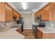 Galley kitchen featuring stainless steel appliances, ample cabinet and countertop space at 117 Ella Kinley Circle # 201, Myrtle Beach, SC 29588