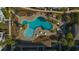 Aerial shot of a pool in a landscaped community featuring palm trees and outdoor seating at 117 Ella Kinley Circle # 201, Myrtle Beach, SC 29588