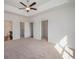 Spacious main bedroom with tray ceiling, carpet floors, and walk-in closets at 1239 Cypress Shoal Dr., Conway, SC 29526