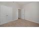 This bedroom features neutral walls, carpet, and white doors at 1239 Cypress Shoal Dr., Conway, SC 29526