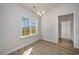 Bright dining area featuring wood floors, large windows and modern light fixture at 1239 Cypress Shoal Dr., Conway, SC 29526