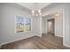 Dining area featuring wood flooring, a chandelier, and abundant natural light at 1239 Cypress Shoal Dr., Conway, SC 29526