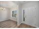 Inviting foyer with wood flooring, a chandelier, and a view to the dining room at 1239 Cypress Shoal Dr., Conway, SC 29526