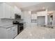 Modern kitchen featuring stainless steel appliances, granite counters and sleek white cabinets at 1239 Cypress Shoal Dr., Conway, SC 29526