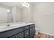 Bathroom showcasing double sinks, modern vanity, and a mirror with decorative lighting fixtures at 124 Old Chimney Ln, Conway, SC 29526