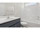 Bright bathroom featuring a sleek vanity and a shower-tub combo with white tile surround at 124 Old Chimney Ln, Conway, SC 29526