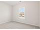 Bedroom showcasing neutral carpet and a window providing ample natural light and outdoor views at 124 Old Chimney Ln, Conway, SC 29526