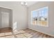 Bright dining room featuring wood floors, large windows, and an elegant light fixture at 124 Old Chimney Ln, Conway, SC 29526