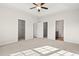 Spacious main bedroom featuring walk-in closets, neutral carpet, and ensuite bathroom access at 124 Old Chimney Ln, Conway, SC 29526