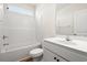 Well-lit bathroom showcases white fixtures, a shower-tub combo, and a clean aesthetic at 124 Old Chimney Ln, Conway, SC 29526
