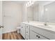 Bright bathroom featuring double sink vanity, ample counter space and wood-look flooring at 124 Old Chimney Ln, Conway, SC 29526