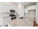 Modern kitchen boasts granite countertops, stainless steel appliances, and ample cabinet space at 124 Old Chimney Ln, Conway, SC 29526