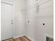View of laundry room with utility hookups, storage shelves, and a door to the exterior at 124 Old Chimney Ln, Conway, SC 29526