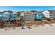 Charming, colorful beach homes with elevated decks and walkways, offering stunning coastal views and beachfront living at 1417 S Ocean Blvd. # 202, Surfside Beach, SC 29575