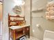 Bathroom with a furniture-style vanity, marble countertop, and decorative shelving at 1424 Glenns Bay Rd. # 1424, Myrtle Beach, SC 29575