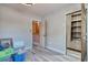 An empty room with light wood laminate flooring, an open closet, and a view to an adjacent room at 1424 Glenns Bay Rd. # 1424, Myrtle Beach, SC 29575