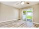 Clean bedroom design with sliding glass doors to an adjacent room and sleek wood-look floors at 1424 Glenns Bay Rd. # 1424, Myrtle Beach, SC 29575