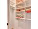 Organized walk-in closet with built-in shelving and neatly arranged towels at 1424 Glenns Bay Rd. # 1424, Myrtle Beach, SC 29575