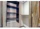 Closet interior featuring built in shelving and rack with wood trim at 1424 Glenns Bay Rd. # 1424, Myrtle Beach, SC 29575