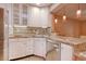 Sunlit kitchen with stainless steel appliances, tile backsplash, and breakfast bar at 1424 Glenns Bay Rd. # 1424, Myrtle Beach, SC 29575