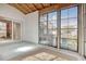 Bright sunroom featuring large windows, a sliding glass door, and stylish rug at 1424 Glenns Bay Rd. # 1424, Myrtle Beach, SC 29575