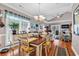 Open-concept dining room with a chandelier, hardwood floors, and views of the living room at 1424 Powhaton Dr., Myrtle Beach, SC 29577