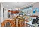 Cozy dining area featuring a chandelier, hardwood floors, and views of the modern kitchen at 1424 Powhaton Dr., Myrtle Beach, SC 29577