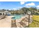 Community swimming pool with lounge chairs, a clubhouse, and mature trees for relaxation at 1424 Powhaton Dr., Myrtle Beach, SC 29577