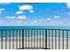 Outdoor balcony with black metal railing features beautiful views of the ocean and beach at 1425 S Ocean Blvd. # 7C, North Myrtle Beach, SC 29582