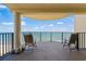 Inviting balcony with chairs providing stunning views of the ocean and beach at 1425 S Ocean Blvd. # 7C, North Myrtle Beach, SC 29582