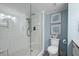 Contemporary bathroom featuring a glass-enclosed shower and neutral gray tiling at 1425 S Ocean Blvd. # 7C, North Myrtle Beach, SC 29582