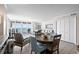 Bright dining area features seating and ocean views from sliding doors leading to the balcony at 1425 S Ocean Blvd. # 7C, North Myrtle Beach, SC 29582