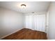 Comfortable bedroom featuring hardwood floors, closet space, and a neutral color palette at 1500 Deer Creek Rd. # C, Surfside Beach, SC 29575