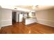 Open concept living space with hardwood floors flowing into the kitchen with granite countertops at 1500 Deer Creek Rd. # C, Surfside Beach, SC 29575