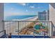 Spacious balcony overlooking the beach, water feature, and ocean views at 158 Seawatch Dr. # 1112, Myrtle Beach, SC 29572