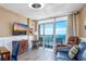 Inviting living room with TV and balcony access offering stunning ocean views at 158 Seawatch Dr. # 1112, Myrtle Beach, SC 29572