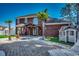 Outdoor living space features a pergola, playhouse, and beautiful brick-paved patio at 1585 Brookgreen Dr., Myrtle Beach, SC 29577