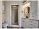 Bathroom featuring a white vanity, round mirror, and a shower with glass door at 1585 Brookgreen Dr., Myrtle Beach, SC 29577