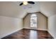 Cozy bedroom features a large window with natural light and beautiful hardwood floors at 1585 Brookgreen Dr., Myrtle Beach, SC 29577