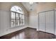 Bedroom with white wainscoting, large window, and hardwood floors at 1585 Brookgreen Dr., Myrtle Beach, SC 29577