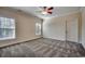 Bedroom with neutral walls, carpeted floors, and two windows allowing natural light at 1585 Brookgreen Dr., Myrtle Beach, SC 29577