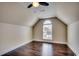 Charming bedroom featuring vaulted ceilings, a ceiling fan and a decorative arched window at 1585 Brookgreen Dr., Myrtle Beach, SC 29577