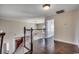 Hallway with hardwood flooring and stairway with white wooden spindles at 1585 Brookgreen Dr., Myrtle Beach, SC 29577