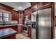 Kitchen featuring stainless steel appliances, dark wood cabinets, and a refrigerator with an ice maker at 1585 Brookgreen Dr., Myrtle Beach, SC 29577
